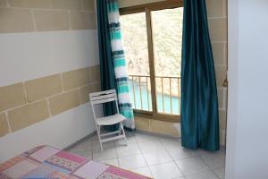 Postel nebo postele na pokoji v ubytování Avalon - Bellevue Gozo