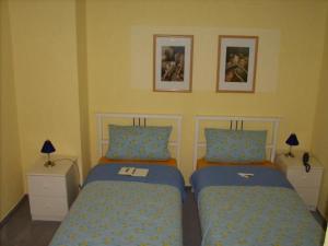 Кровать или кровати в номере Hotel zur Eiche