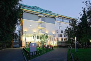 a building with a sign in front of it at Mamaison All-Suites Spa Hotel Pokrovka in Moscow