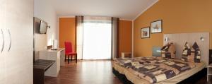 Postel nebo postele na pokoji v ubytování Auszeit Cafè & Hotel