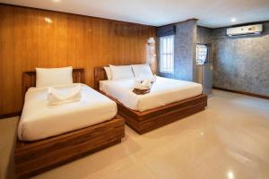 Ένα ή περισσότερα κρεβάτια σε δωμάτιο στο Viking Resorts