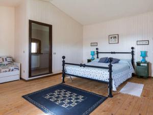 a bedroom with a bed and a large mirror at Private pool Villa Wine&cooking -Trasimeno Lake in Panicale +41 photos