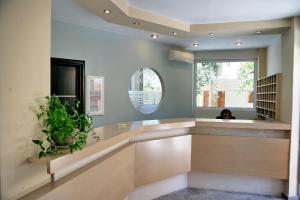 a room with a mirror and a person in the window at Sunset Hotel in Petra +96 photos