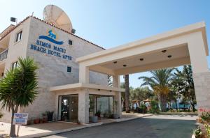 a building with a sign on the front of it at Simos Magic Beach Hotel Apts in Ayia Napa