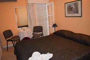 
Cama o camas de una habitación en Nuevo Hotel Plaza
