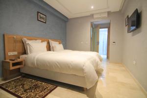 Postel nebo postele na pokoji v ubytování Hotel Kenzo + 22 fotografií