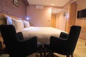 TV a/nebo společenská místnost v ubytování Hotel Kenzo