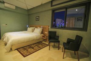 Postel nebo postele na pokoji v ubytování Hotel Kenzo