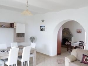 a kitchen and living room with a table and chairs at Casa dei Nonni in Vasto