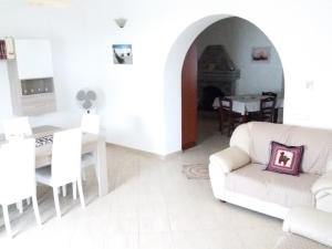 a white living room with a couch and a table at Casa dei Nonni in Vasto +22 photos