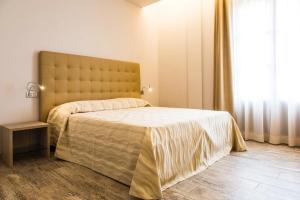 A bed or beds in a room at Il Feudo Di Agnadello