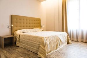 Giường trong phòng chung tại Il Feudo Di Agnadello