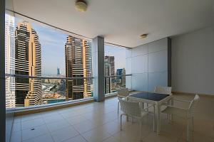 a dining room with a view of a city at RH- Skyview Tower, Dubai Marina, 1BR with Burj-Al-Arab, sea views in Dubai