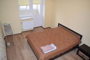 Postel nebo postele na pokoji v ubytování Apartment on Demyanchuka 1A