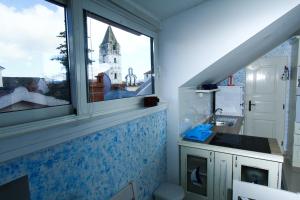 a bathroom with a sink and a window at Two rustikal apartments in Vila ''U Kali'' close to the beach, reserved parking place in Sveti Filip i Jakov +57 photos