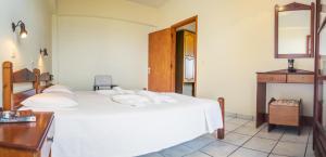 Postel nebo postele na pokoji v ubytování Yiannis Ηotel