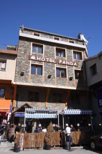 a man standing in front of a hotel panama at Hotel Panda in Pas de la Casa