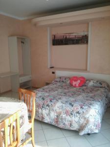 A bed or beds in a room at Parco Sogni d'Oro