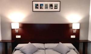 Llit o llits en una habitació de Apartamento Rural La Plaza Vieja