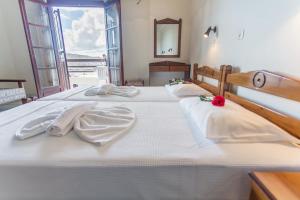 Postel nebo postele na pokoji v ubytování Yiannis Ηotel