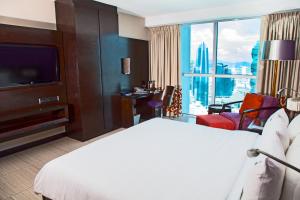 Cama ou camas em um quarto em Megapolis Hotel Panama