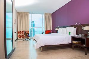 Cama ou camas em um quarto em Megapolis Hotel Panama