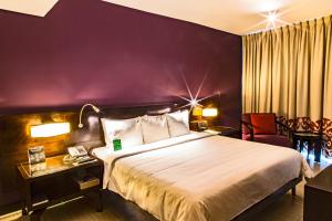 Cama ou camas em um quarto em Megapolis Hotel Panama
