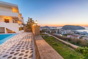 a villa with a view of the ocean at Yiannis Ηotel in Arkasa