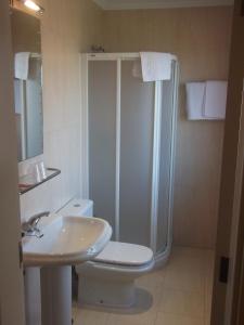 a bathroom with a shower and a toilet and a sink at Val de Serantes in Ferrol