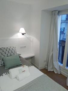 Posteľ alebo postele v izbe v ubytovaní Apartamento El Reloj