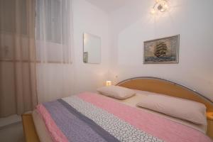 Posteľ alebo postele v izbe v ubytovaní Apartment Nikita