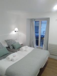 Posteľ alebo postele v izbe v ubytovaní Apartamento El Reloj