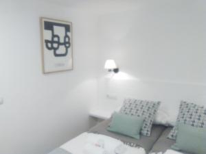 Posteľ alebo postele v izbe v ubytovaní Apartamento El Reloj
