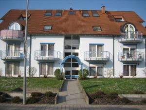 a large white building with a red roof at LITTLE ITALY Studio - EP Ticket Garantie in Rust