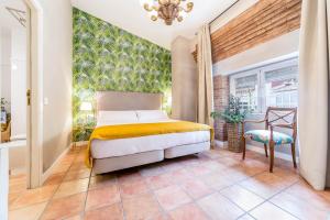 Posteľ alebo postele v izbe v ubytovaní Palacio de Rojas by Moontels