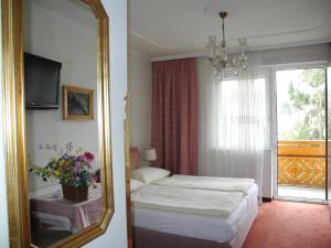 Postel nebo postele na pokoji v ubytování Hotel Rosner