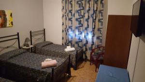 A bed or beds in a room at Albergo Ristorante Poli