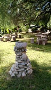 a stack of rocks sitting in a cemetery at Residencial Castelar in Merlo