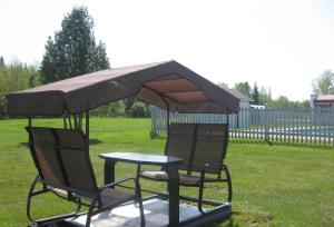 Сад в Motel de la Pente Douce