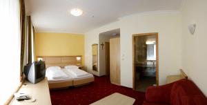 Postel nebo postele na pokoji v ubytování AKTIVHOTEL Weisser Hirsch