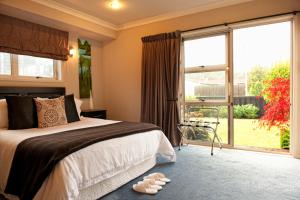 Postel nebo postele na pokoji v ubytování B&B@The Redwoods