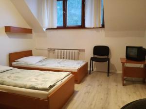 Posteľ alebo postele v izbe v ubytovaní Corum