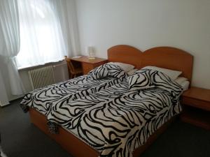 Posteľ alebo postele v izbe v ubytovaní Corum