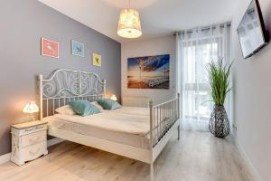 Postel nebo postele na pokoji v ubytování Staywin Aura Gdańsk I
