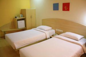 Postel nebo postele na pokoji v ubytování Ginger Pune - Pimpri