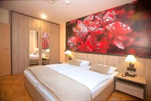 Postel nebo postele na pokoji v ubytování Hotel Calypso