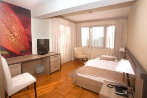 TV a/nebo společenská místnost v ubytování Hotel Calypso