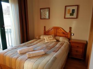 Postel nebo postele na pokoji v ubytování Hostal Maury