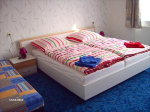En eller flere senge i et værelse på Ferienhaus Benneckenstein