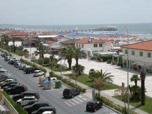a city street filled with lots of parked cars at Hotel Piccadilly in Lido di Camaiore